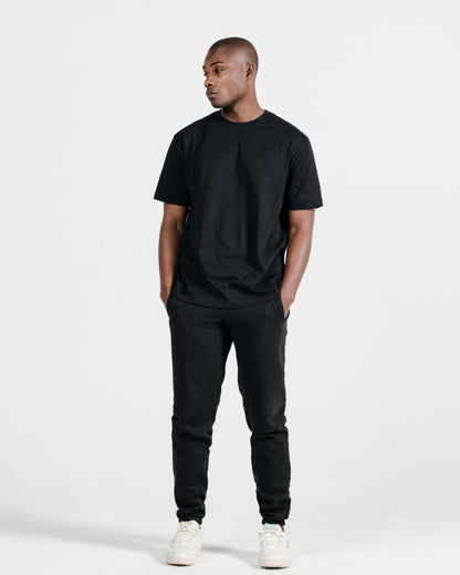 Model wearing Robenti Black Organic Cotton Sweatpants