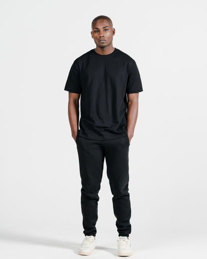 Model wearing Robenti Black Organic Cotton Sweatpants