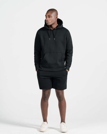 Model wearing Robenti Black Organic Cotton Sweatshorts